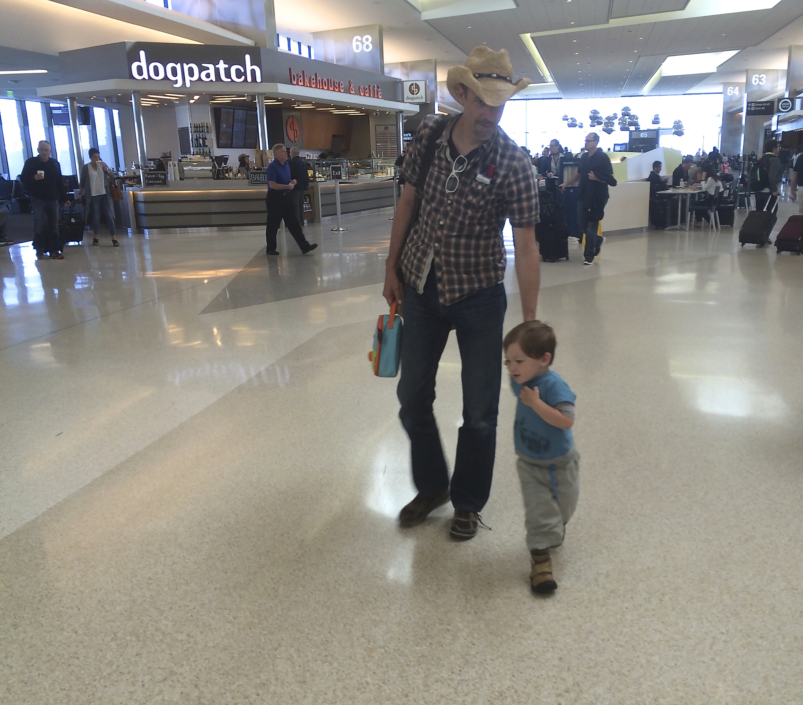 conor_dad_airport_holdinghands