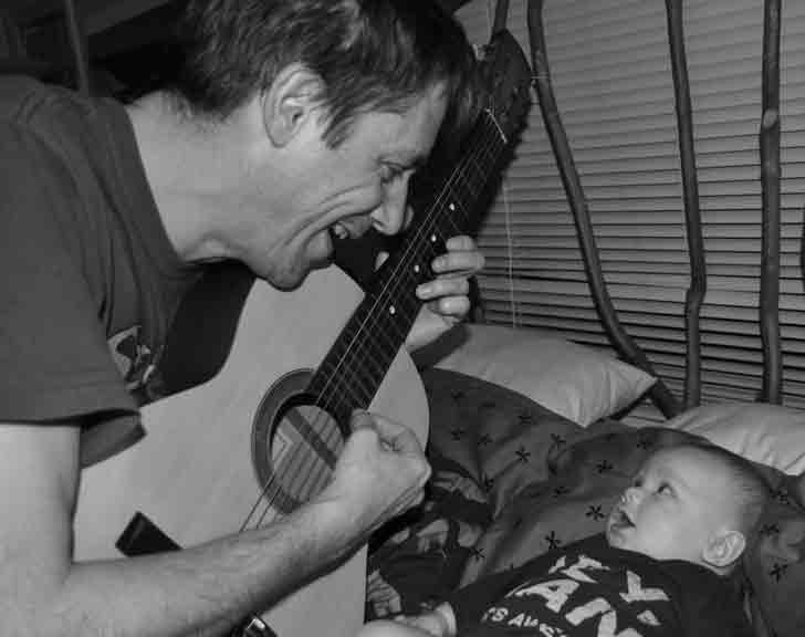 DadsDecoded image of steve playing guitar for conor